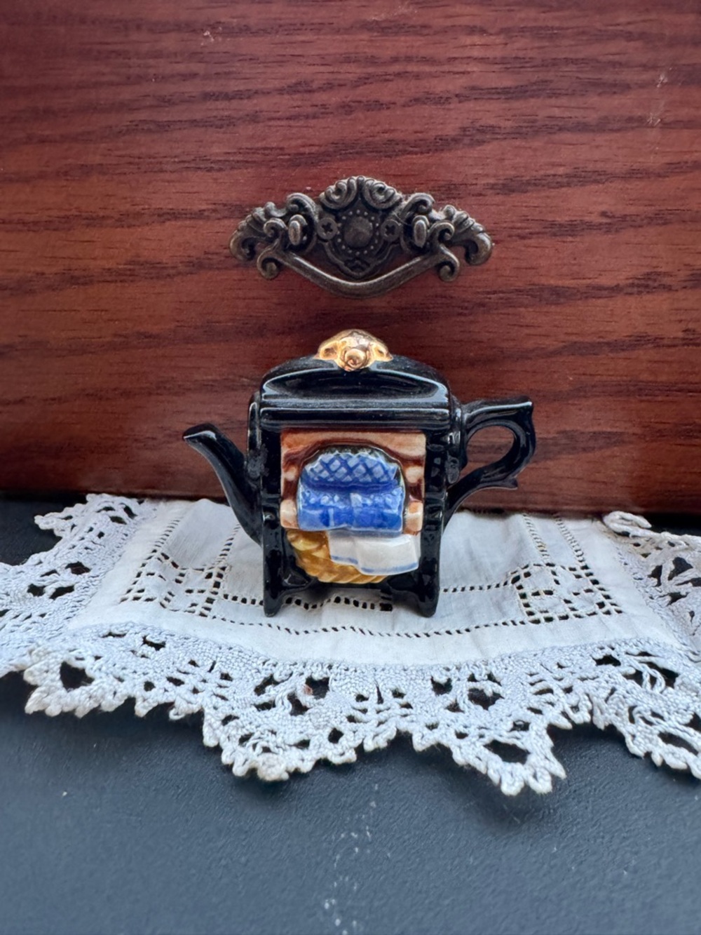 Black Ceramic Teapot Figurine with Blue and Cream Accent